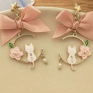 Cute pink bow, white cat earrings.